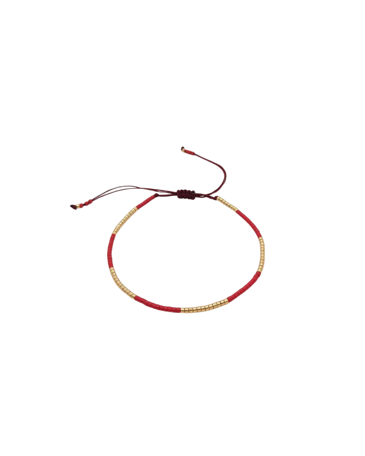 Bracelet with red and gold cord on a white background