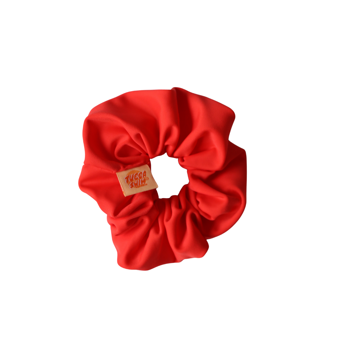 Red scrunchie with a brand label on a white background