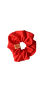 Red scrunchie with a brand label on a white background