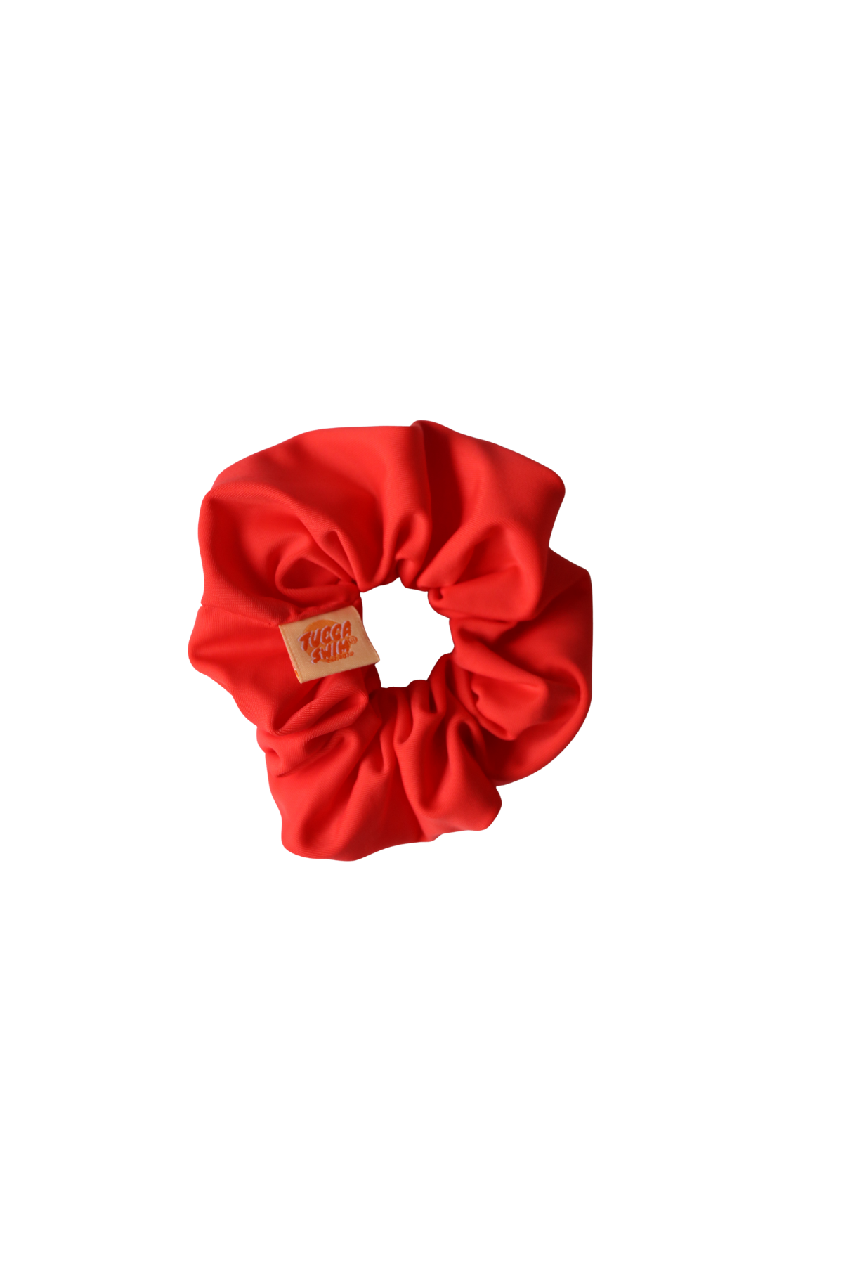 Red scrunchie with a brand label on a white background