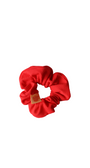 Red textured scrunchie on a white background